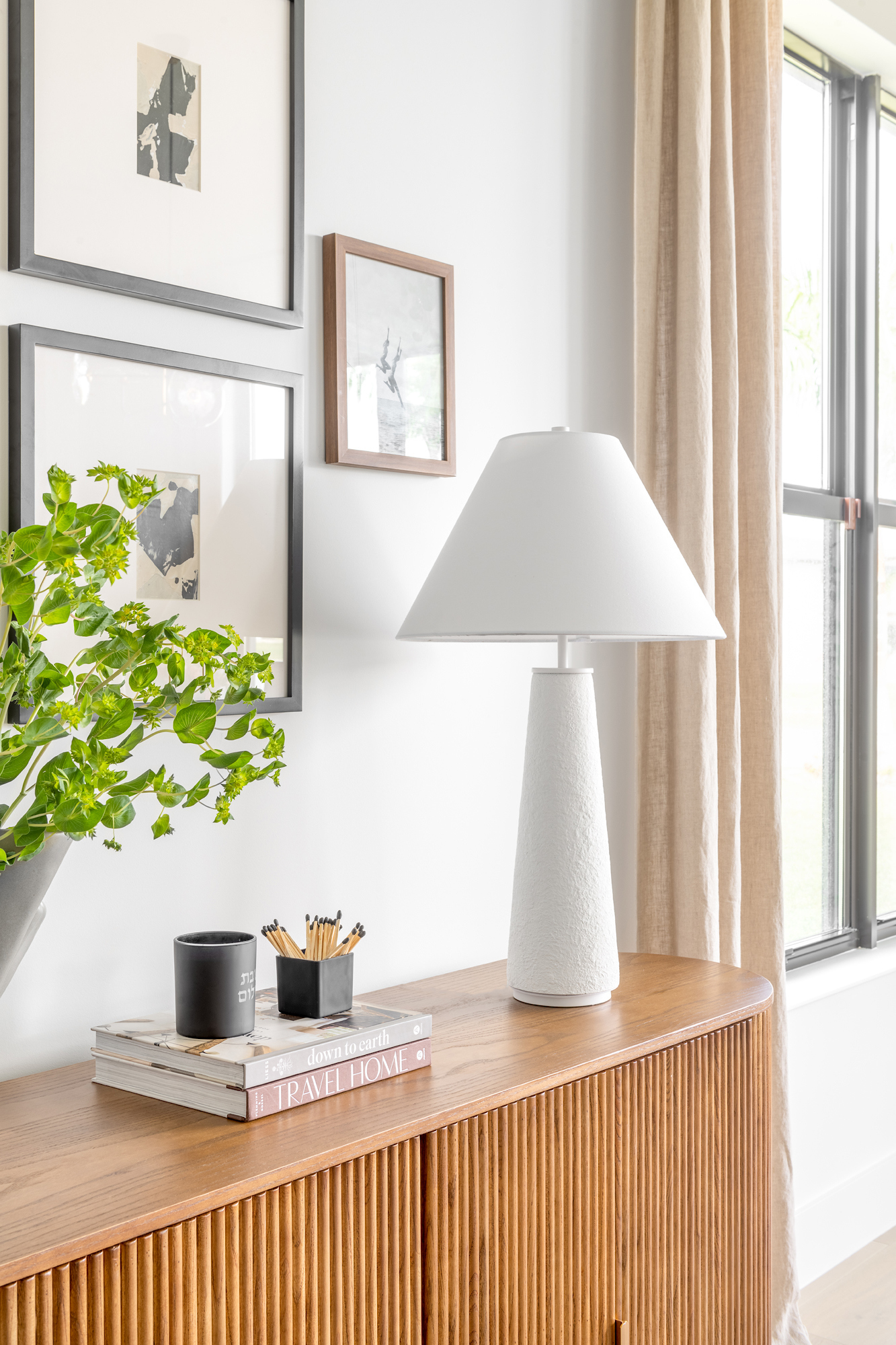 Styled console vignette with art and layered objects